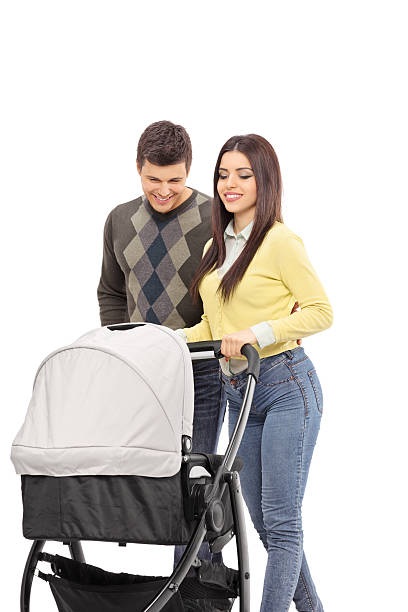 istock Young parents pushing a baby stroller 467948204
