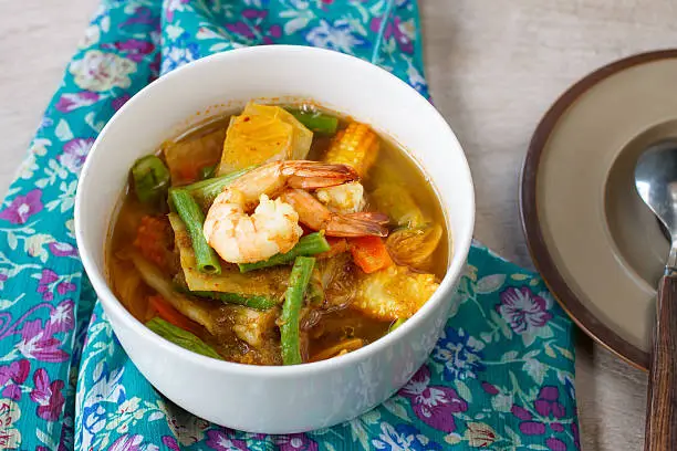 Photo of spicy sour soup vegetable with shrimp