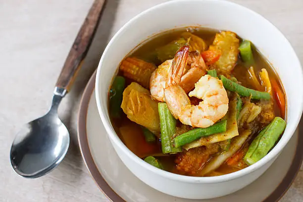 Photo of spicy sour soup vegetable with shrimp