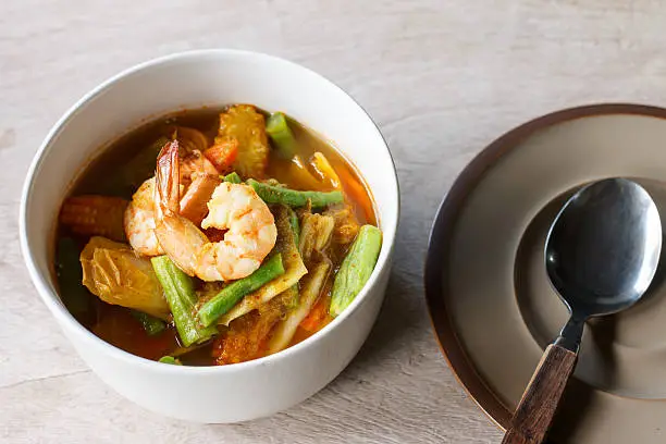 Photo of spicy sour soup vegetable with shrimp