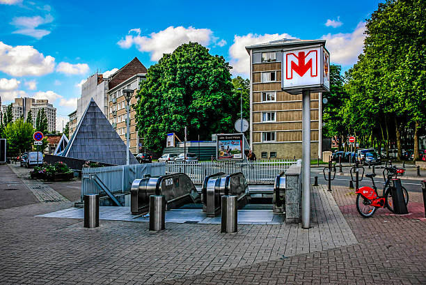 Lille, France - June 26, 2012: Metro station sign and escalator leading to the underground station in this regional city