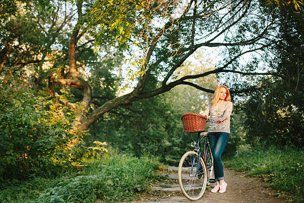 istock Young blonde woman on a vintage bicycle 467953430