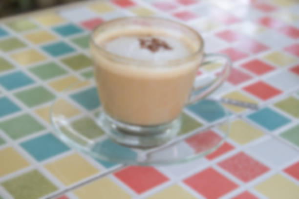 istock blurry defocused hot cappuccino coffee with cinnamon topping for 467954984