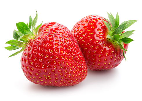 Two strawberries close up on white background