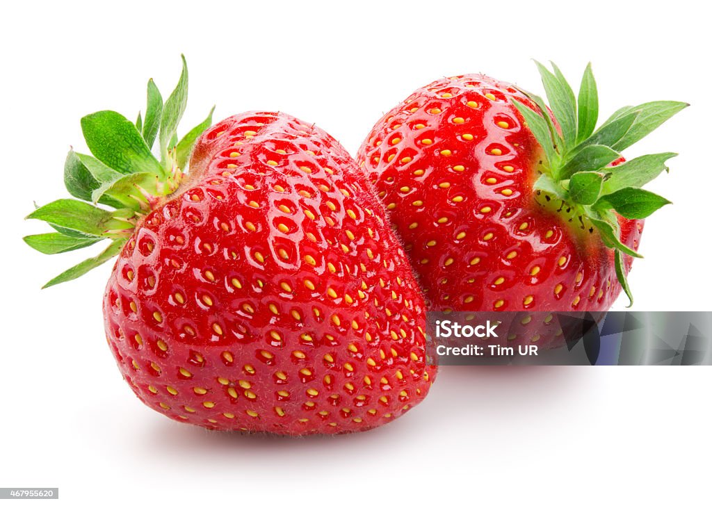 Two strawberries close up on white background Strawberry Stock Photo