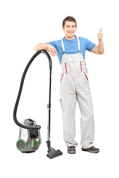 istock Male cleaner with a vacuum 467959111
