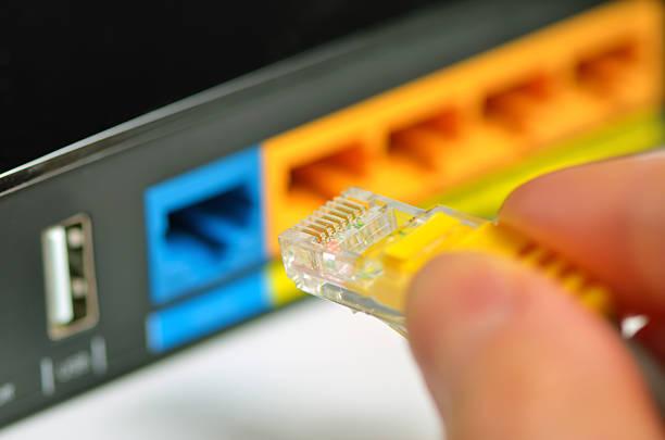 Router network hub with patch cable Router with cable wires, IT industry internet router with cable wires computer network router communication internet stock pictures, royalty-free photos & images