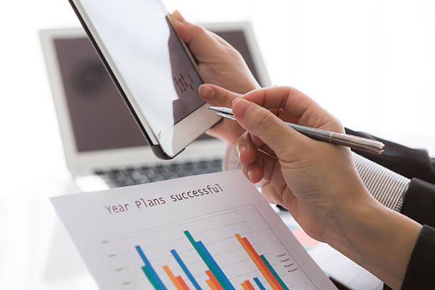 istock Close-up of  business team using digital tablet with financial d 467966361