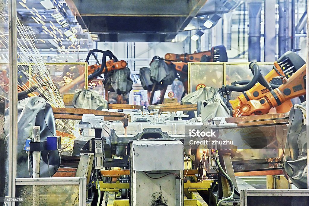 robots welding in a car factory Robotic Arm Stock Photo