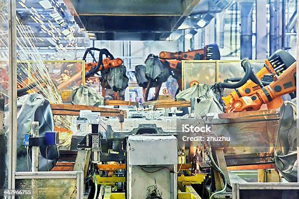 Robots Welding In A Car Factory Stock Photo - Download Image Now - Robotic Arm, Machinery, Car