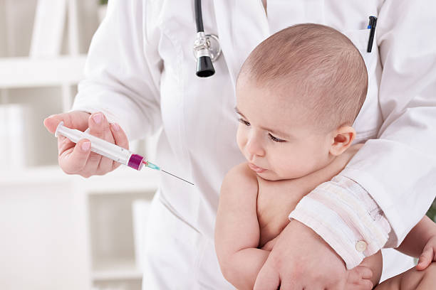 istock Doctor giving a child a vaccine 467969668