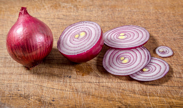 istock sliced red onion on wooden background 467971604