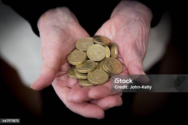 Elderly Hands Holding British Pound Coins Stock Photo - Download Image Now - British Coin, Human Hand, Adults Only