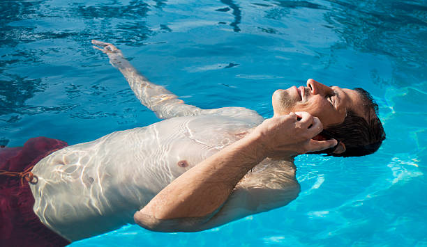 istock relax businessman using phone by swimming pool 467971957