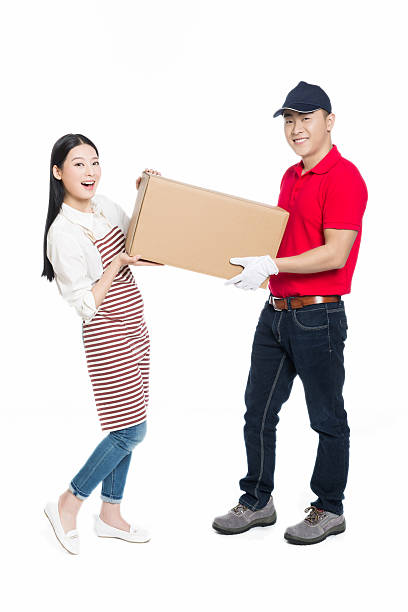 Young asian couple open gift box happily at home