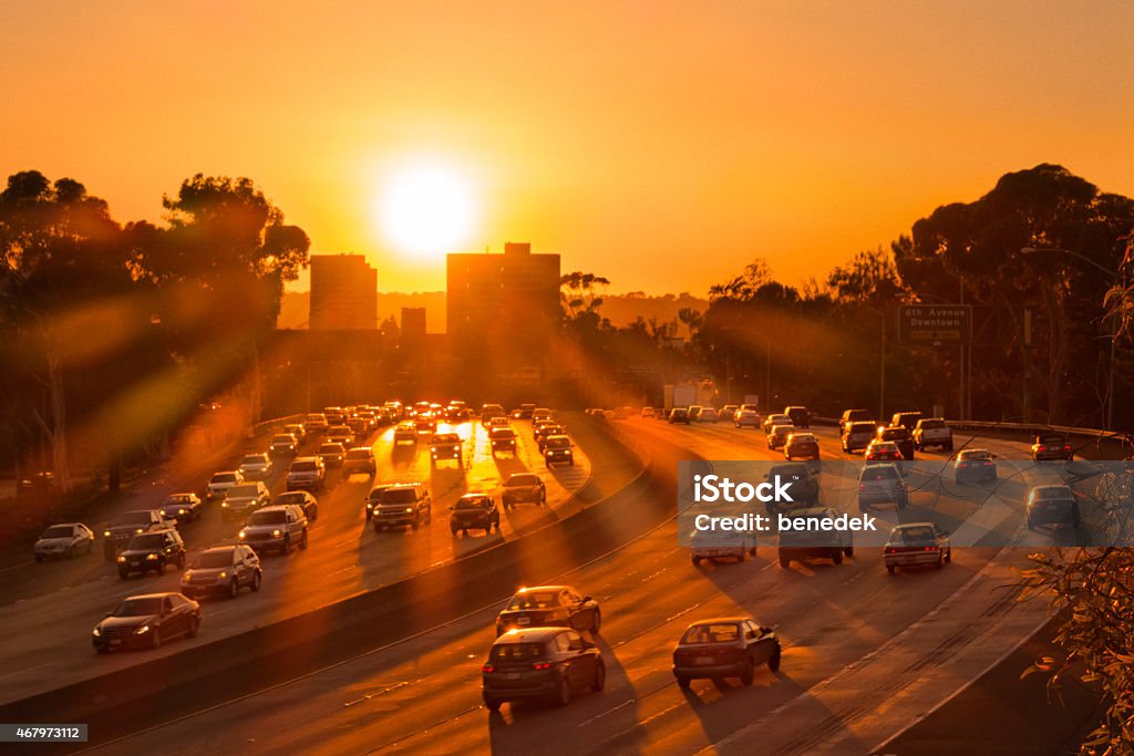 Freeway Traffic in San Diego California at Sunset Photograph showing cars in highway traffic on Interstate 5 in warm orange sunset colors in San Diego, California, USA Traffic Stock Photo