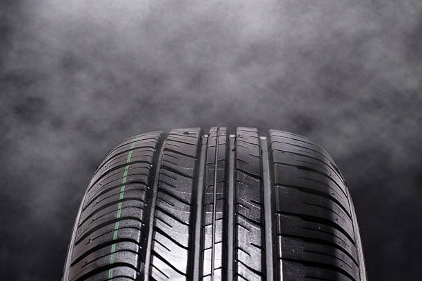 istock Tire Car with smoke on black background 467973674