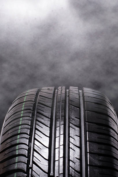 istock Tire Car with smoke on black background 467973676