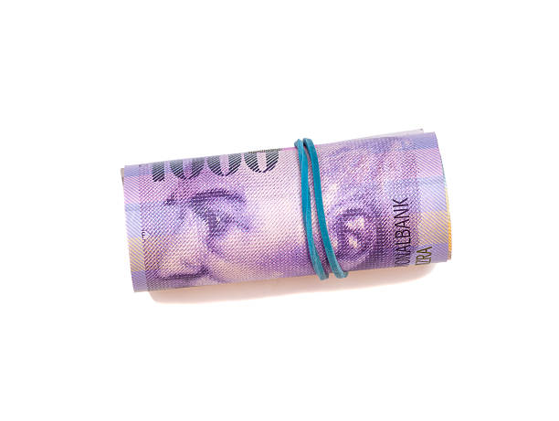 istock Swiss thousand francs in a roll on white background 467973990