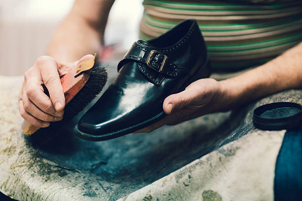 istock Unrecognizable Shoemaker Polishing Shoes. 467974836