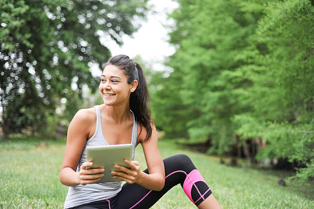 istock Young Woman looking at a digital tablet 467974854