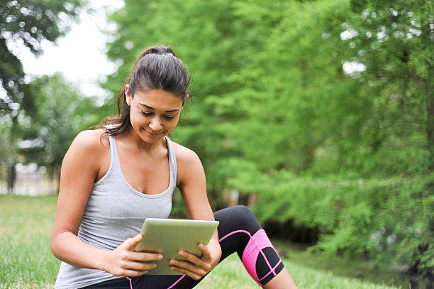 istock Young Woman looking at a digital tablet 467974894