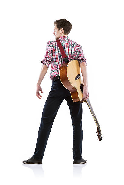 Young guitar player Young handsome guitar player with his instrument. Studio shot on white background. singer back stock pictures, royalty-free photos & images