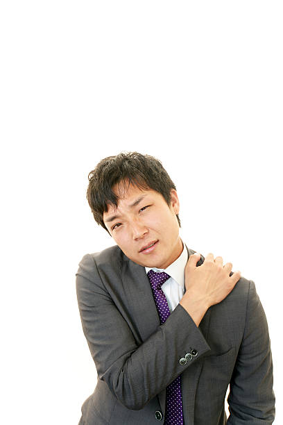 Businessman with shoulder pain.