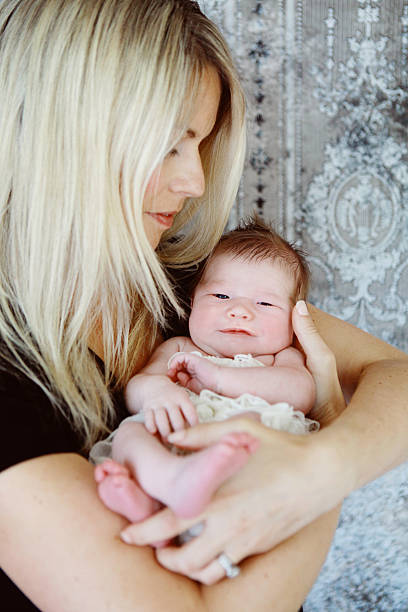 istock Mother and Newborn Daughter 467986384