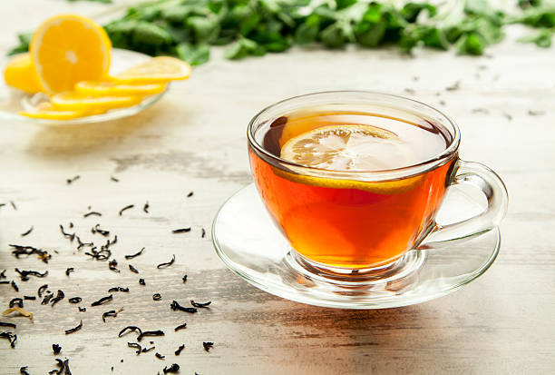 istock Glass cup of tea on a wooden table. 467986716