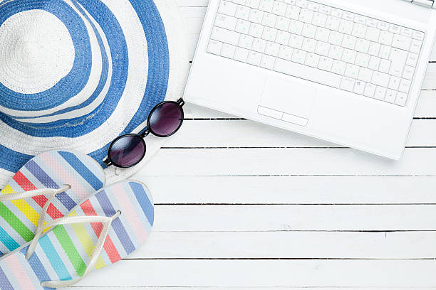 istock White computer and flip flops shoes with clothes 467989496