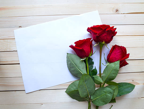 istock Red roses on a wooden table 467989692