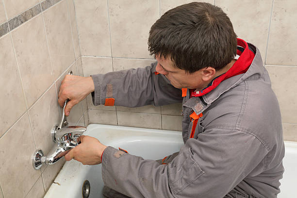 istock Plumber works in a bathroom 467993130