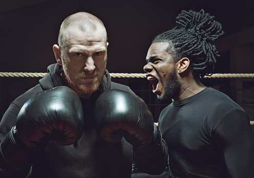 angry black boxer shouting at his opponent