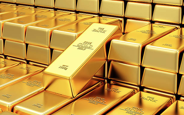 Stack of golden bars in a bank vault