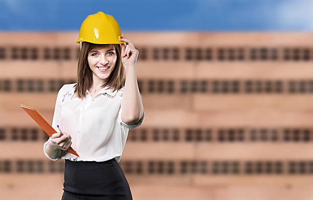 istock young engineer woman with helmet 467997446