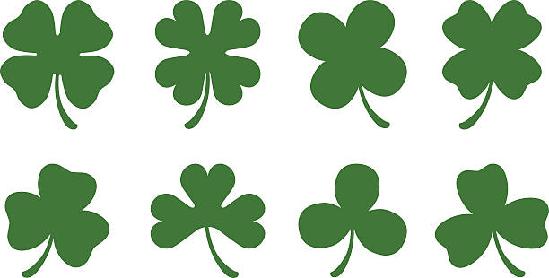 Four and Three Leaf Clovers A set of 8 different clover silhouettes. There are four different three leaf clovers and four different four leaf clovers. shamrock stock illustrations