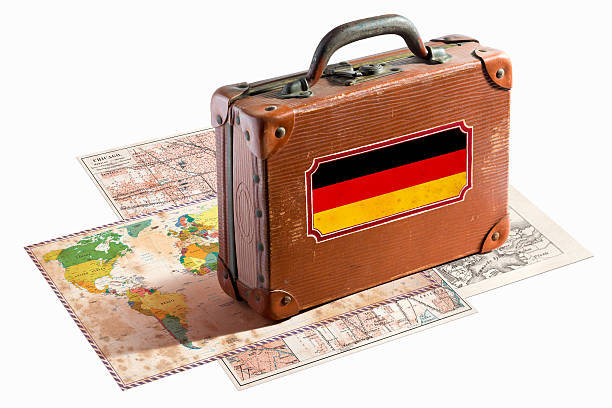 istock Antique leather suitcase with Germany flag on maps 467997579