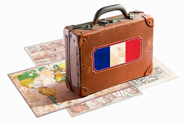 istock Antique leather suitcase with France flag on maps 467997585