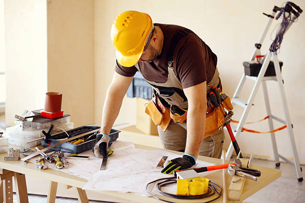 istock Male carpenter in working clothes in a construction workshop 467999916