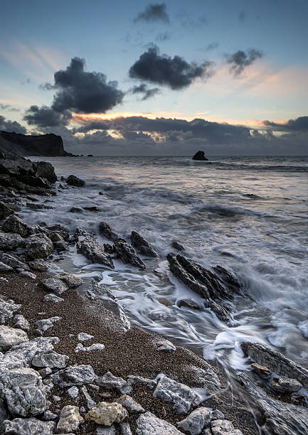 istock Beach sunrise landscape with long exposure waves movement 468001203