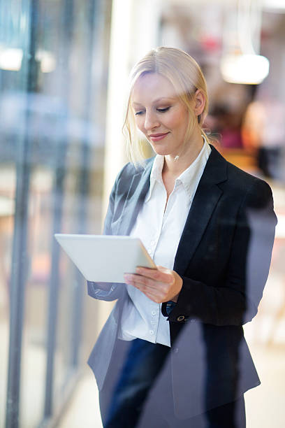 istock Beautiful businesswoman using tablet PC in the office 468012672