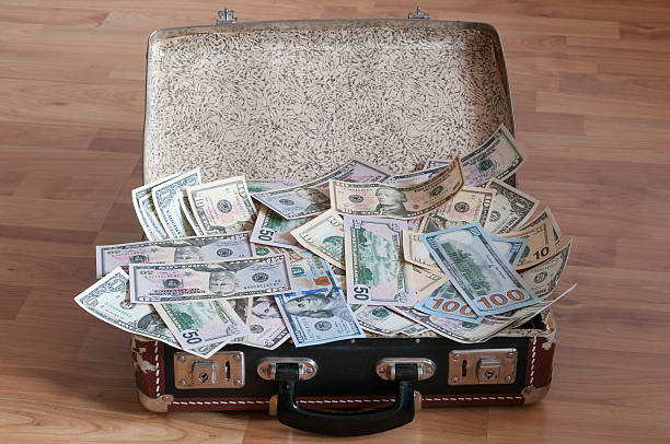 istock Suitcase full of money 468016317