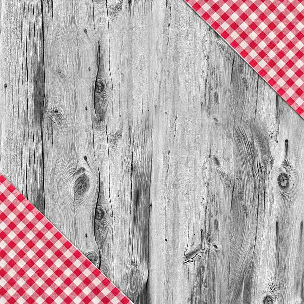 Photo of White and red tablecloth textile on wooden table