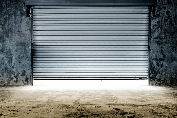 istock Metal garage door opening for the morning's work 468021309