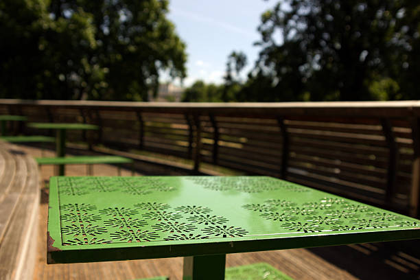 Green outdoor metal lunch table.