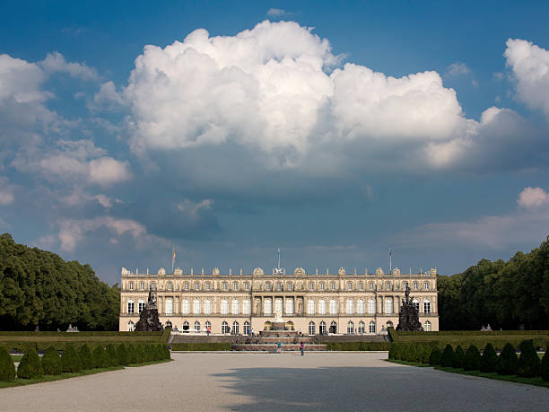 Herrenchiemsee, Germany - August 31, 2013: A fountain i front of the neo-baroque Herrenchiemsee Palace, built in 1878 on an island on lake Chiemsee as a copy of the French palace Versailles by Bavarian king Ludwig II. Now it is open to the public.