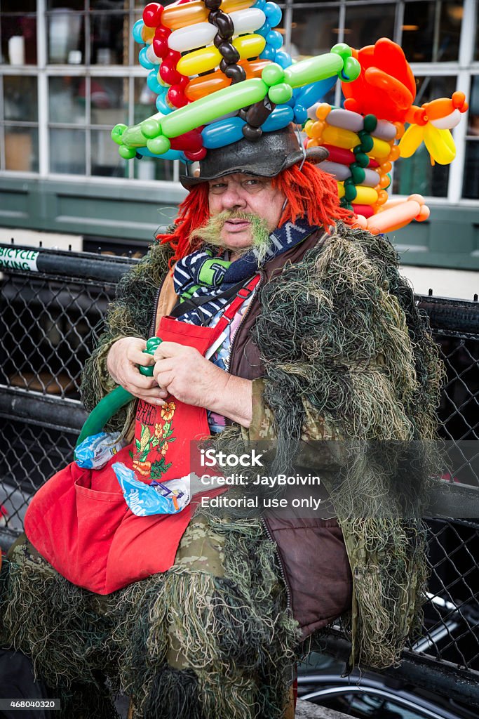 Balloon Clown Pike Place Market, Washington, USA - March 16, 2011: A balloon making clown is performing at the Pike Place Market in Seattle, Washington. 2015 Stock Photo