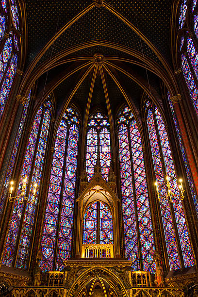 PARIS: Interiors of the Sainte-Chapelle (Holy Chapel) Paris, France - December 24, 2013: Interiors of the Sainte-Chapelle (Holy Chapel). The Sainte-Chapelle is a royal medieval Gothic chapel in Paris and one of the most famous monument of the city. sainte chapelle stock pictures, royalty-free photos & images
