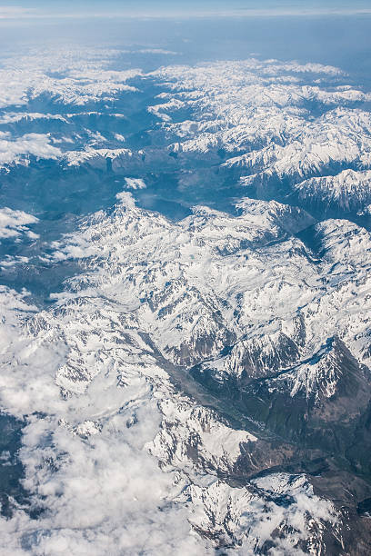 istock Snowy mountains seen from above 468042866